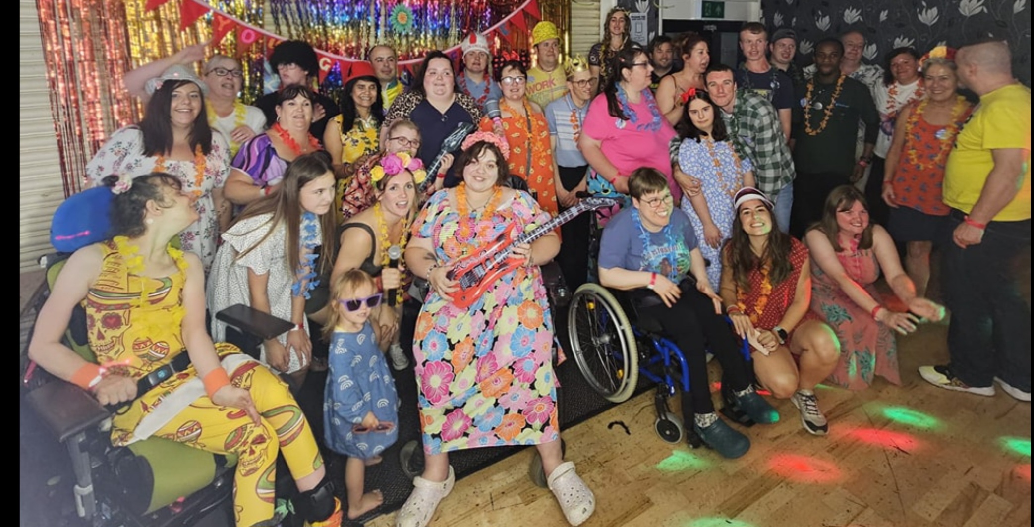 Friends laughing at a charity event.